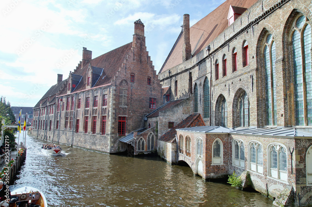 view of the historic city center of Bruges, Medieval brick buildings at canal street in Brugges. Autumn landscape of old historical town in Europe