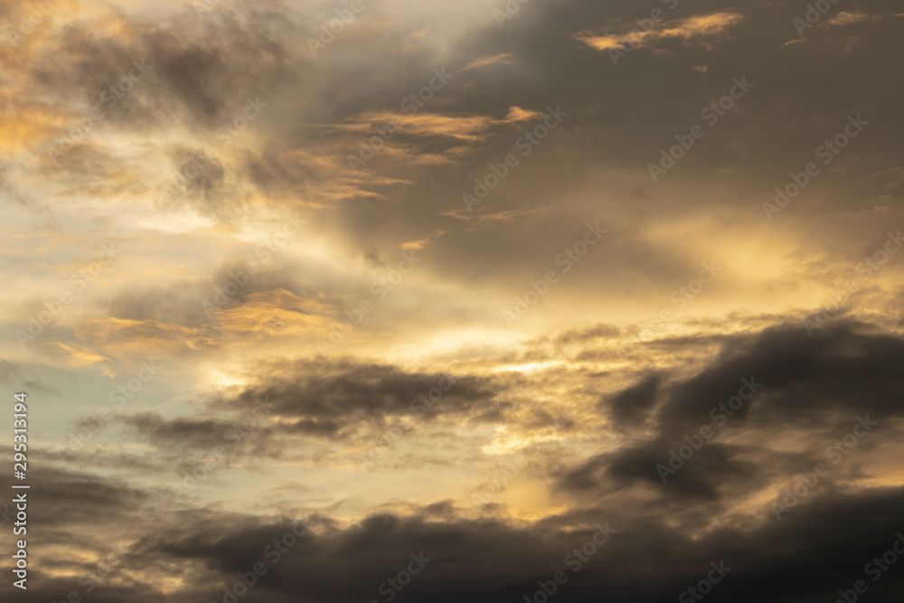 The background image of the evening sky has a beautiful golden light.