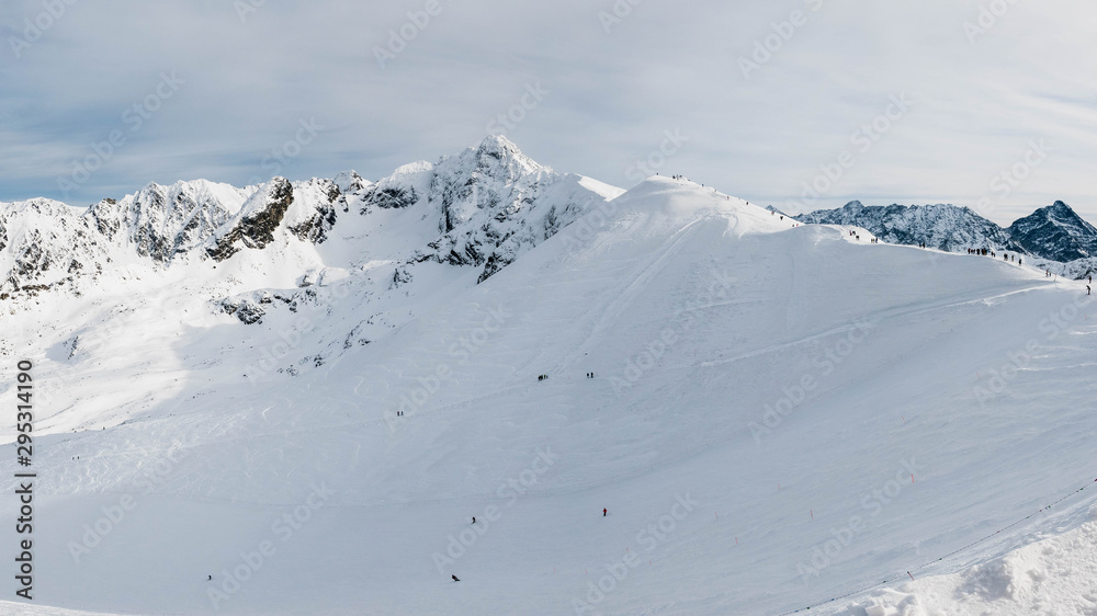 Winter view from Kasprowy Wierch Peak on ski slope and Swinca Peak.
