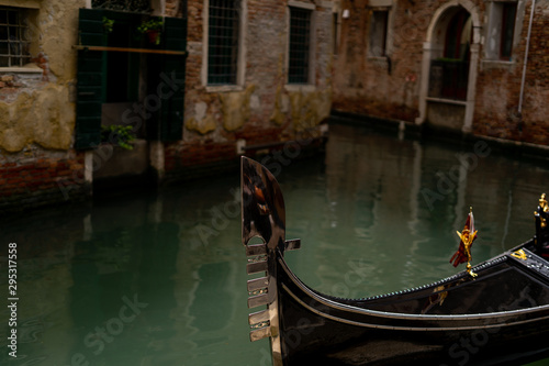 front of a gondola in the heart of venice Italy Europe. beautiful gondola in venice. Venice background wallpapers. gondola in front of the beautiful architecture of Venice © FitchGallery