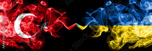 Turkey vs Ukraine, Ukrainian smoke flags placed side by side. Thick colored silky smoke flags of Turkish and Ukraine, Ukrainian photo