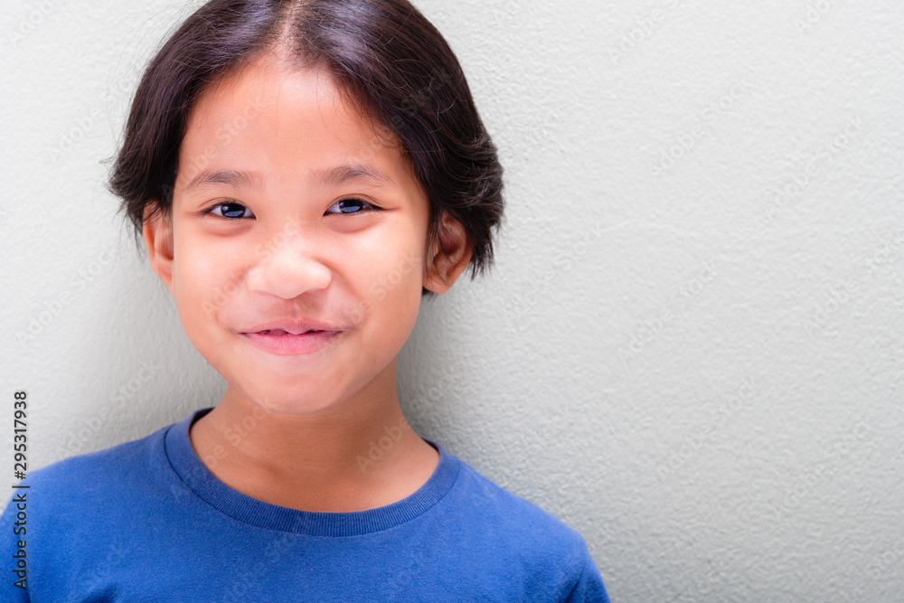 Thai Girl Smiling on Light Green Wall Thai Girl Smiling on Light Green Wall