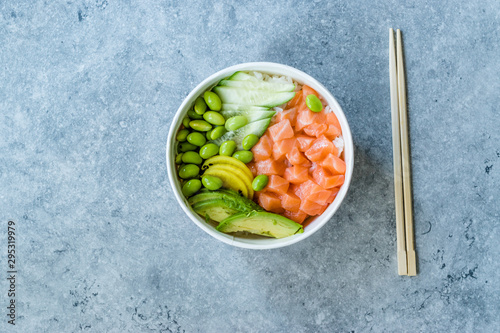 Hawaiian Poke Bowl with Salmon, Edamame, Takuan, Avocado, Cucumber Slices and Rice.