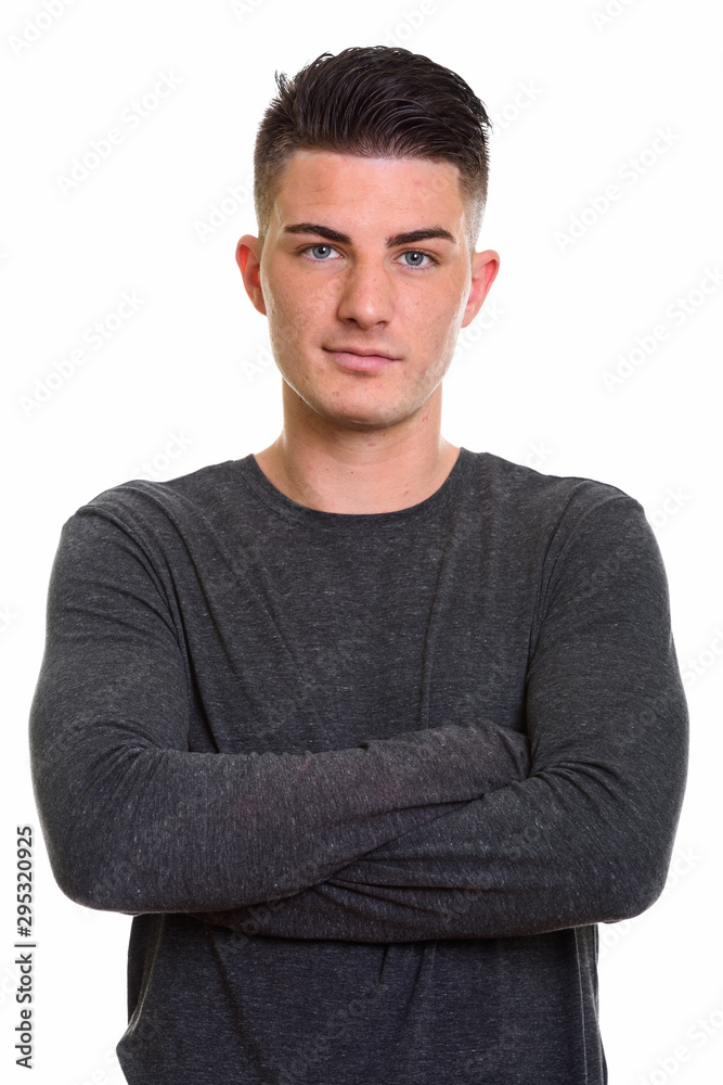 Close up of young handsome man with arms crossed Close up of young handsome man with arms crossed