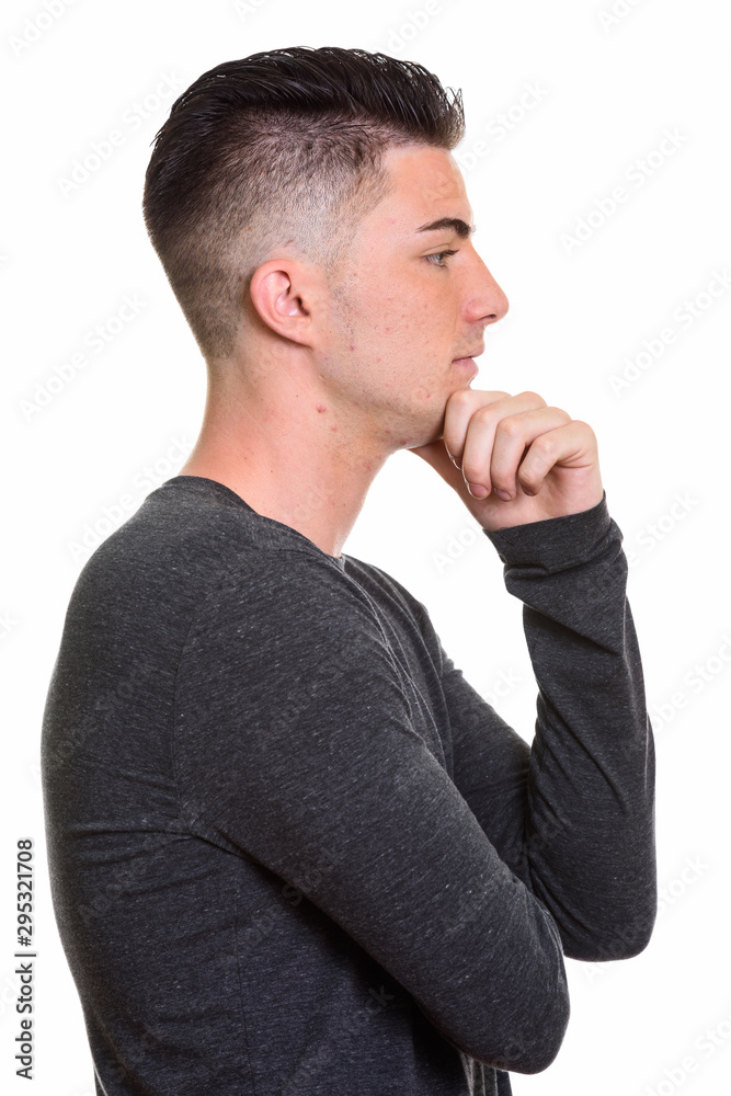 Profile view of young handsome man thinking Profile view of young handsome man thinking