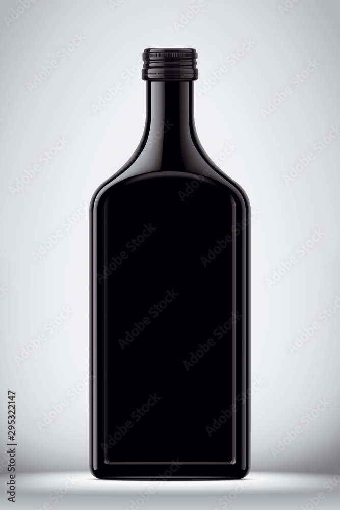 Glass black bottle on gray background Glass black bottle on gray background