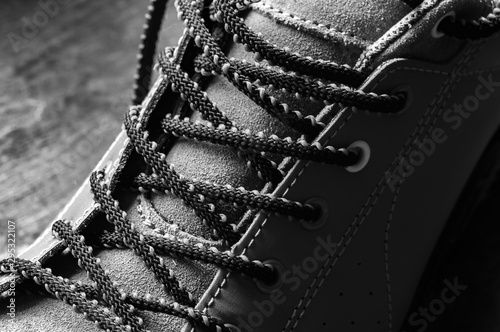 black and white, laces in men's work shoes close-up