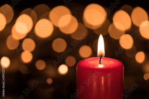 Burning candle on the first Sunday in Advent