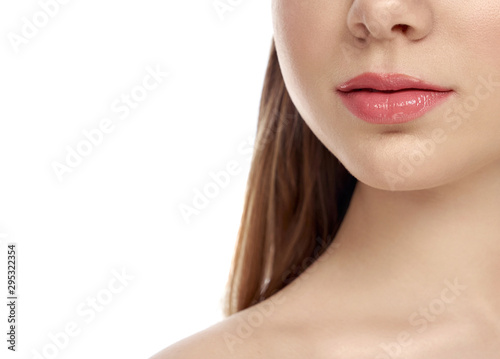 Selective focus of female full lips on isolated background