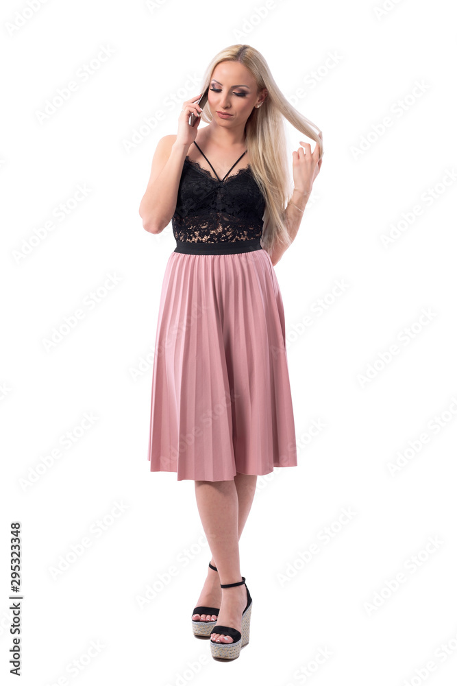 Young relaxed classy woman speaking on the phone spinning and twirling hair  with finger. Full body isolated on white background. Stock Photo | Adobe  Stock