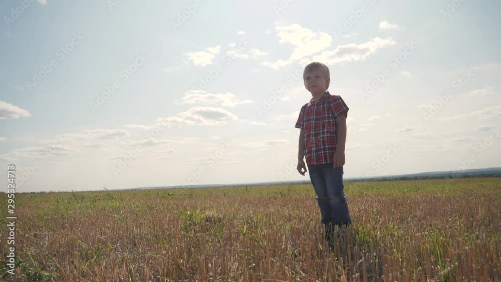 sad little boy lifestyle stands with his back on nature covered his face with his hands is not a happy childhood concept sad little boy lifestyle stands with his back on nature covered his face with his hands is not a happy childhood concept