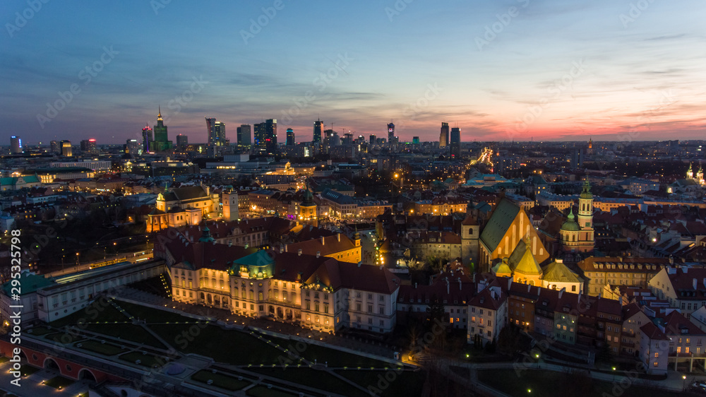 Aerial view of the Old city night Warsaw with the square and the royal palace in the night lighting. 