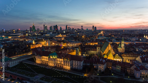 Aerial view of the Old city night Warsaw with the square and the royal palace in the night lighting. 