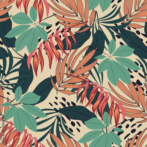 Abstract seamless tropical pattern with bright colorful leaves and plants on pastel background. Seamless exotic pattern with tropical plants. Exotic wallpaper. Trendy summer Hawaii print.