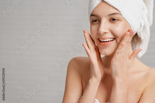 Woman with healthy skin of face posing  smiling.