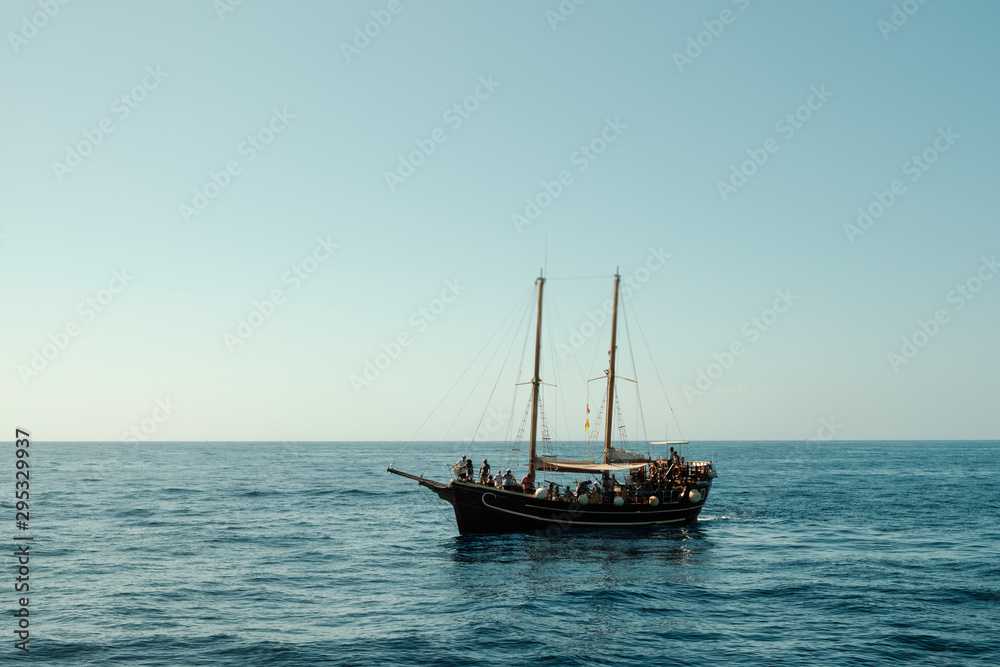 group of people on sailboat on whale watching tour - wooden sailing boat - group of people on sailboat on whale watching tour - wooden sailing boat -