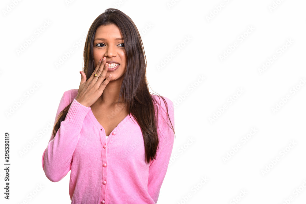 Young happy Brazilian woman smiling and laughing while covering Young happy Brazilian woman smiling and laughing while covering