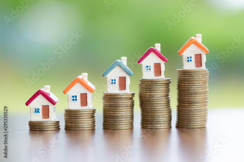 House on the coin, arranged from low to high Concept of starting a business Mortgages and real estate investments Investment for profit