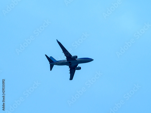 Plane wing land high on blue background