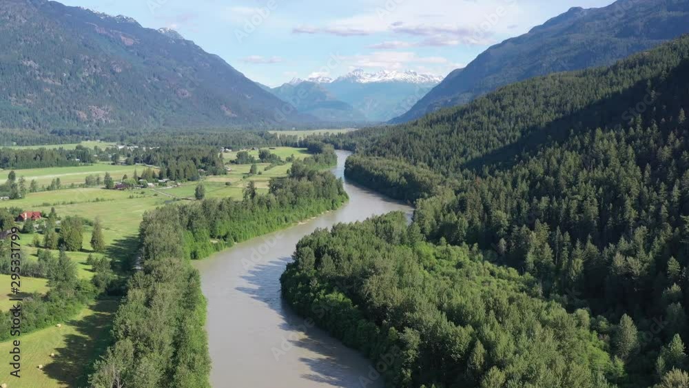 Majestic mountain river in Vancouver, Canada. Drone flying. Aerial view with mountain background. 4K. Majestic mountain river in Vancouver, Canada. Drone flying. Aerial view with mountain background. 4K.