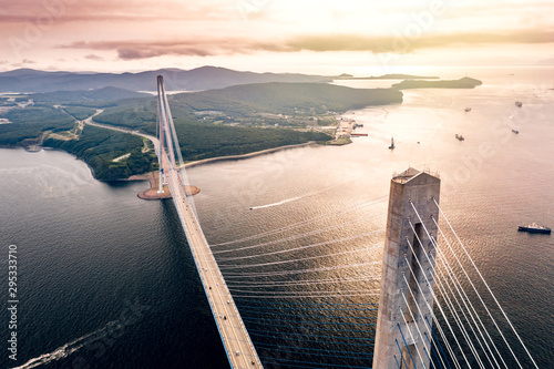 Aerial view of the Russky Bridge connecting Vladivostok city with the Russky Island over the Strait of Eastern Bosphorus. Cable-stayed road bridge over the sea in Primorsky Krai, Far East, Russia photo