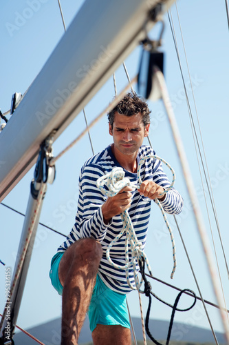 Young man on a sailboat