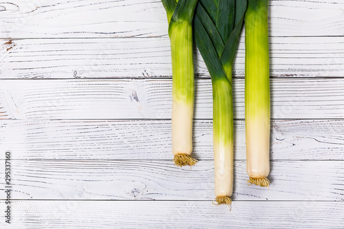 Leek Green Onion on Wooden Background. Selective focus.