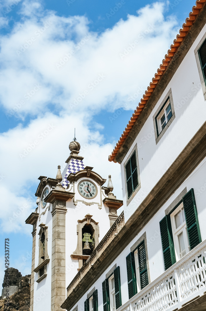 Historic building and Sao Bento Church, Igreja Matriz de Sao Bento, in Ribeira Brava, Madeira, Portugal. Religious temple from different perspective. Small Portuguese village. Architecture