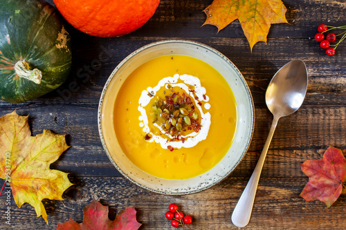 Pumpkin soup on a wooden background. Healthy eating.