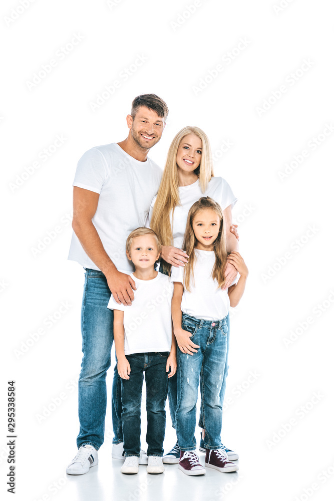 adorable children standing with happy parents and looking at camera on white adorable children standing with happy parents and looking at camera on white