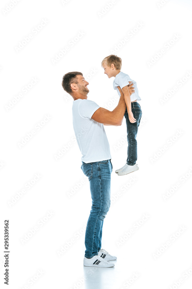 happy dad holding in arms cute son on white