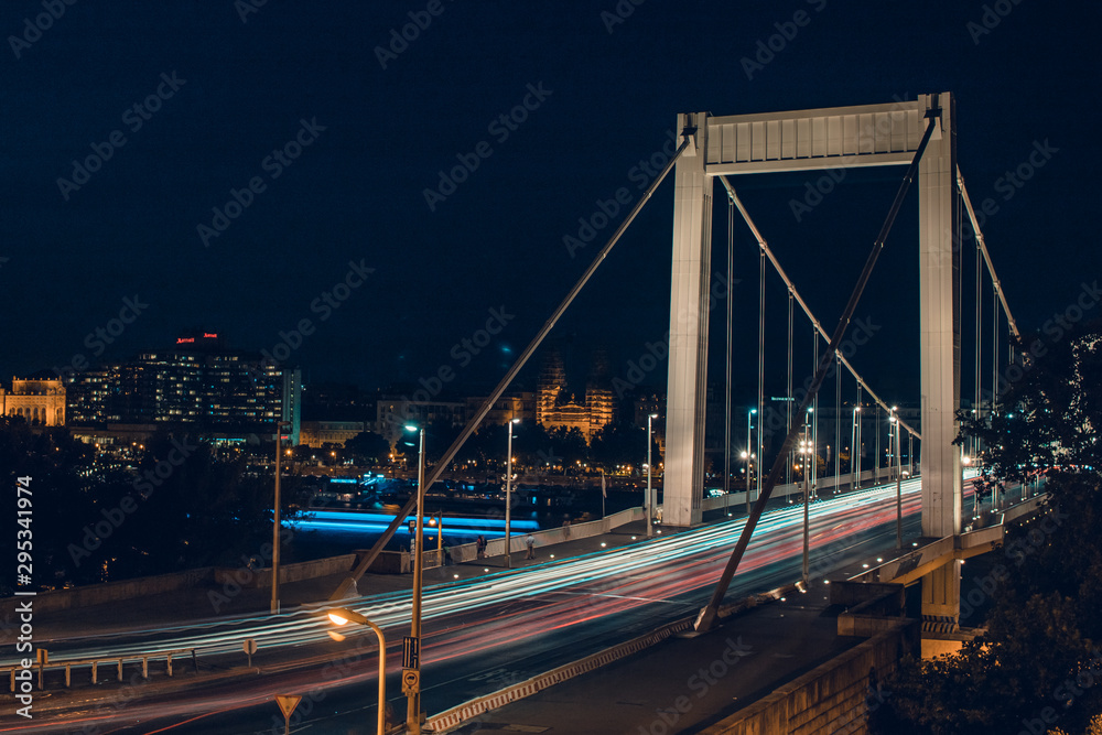 Night time traffic over the Elisabeth bridge. It crosses Danube river and connect Buda and Pest together. Budapest, Hungary.