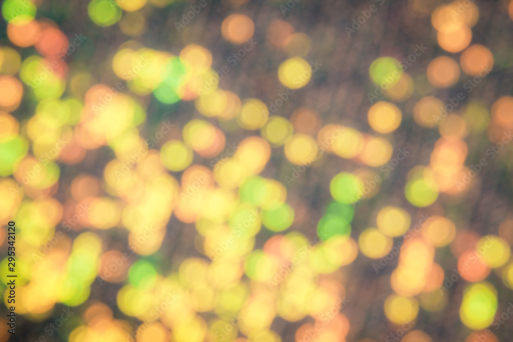 Obraz premium Abstraction christmas golden lights. Background of bright glow bokeh.