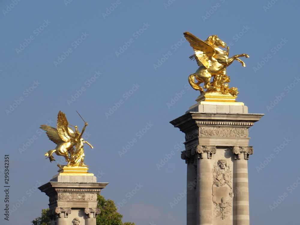 Paris, France - October 13, 2015: Close up of golden winged horse statues in Paris France on a sunny day