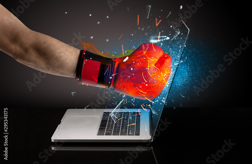 Firing hand hitting strongly laptop screen glass © ra2 studio