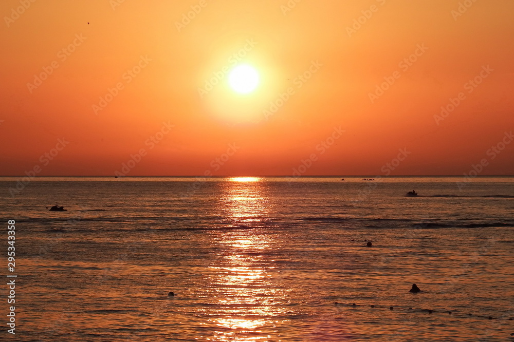Beautiful sunset over the warm sea in summer.