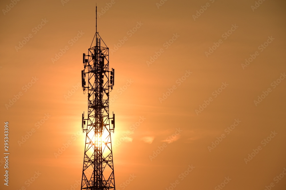 Wireless telephone pole and sunrise orange-yellow sky In the early morning of the day Wireless telephone pole and sunrise orange-yellow sky In the early morning of the day