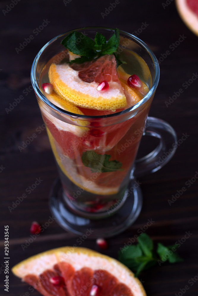 healthy eating. fresh red cocktail with ripe grapefruit and orange. detox water. diet healthy eating and weight loss concept. top view healthy eating. fresh red cocktail with ripe grapefruit and orange. detox water. diet healthy eating and weight loss concept. top view