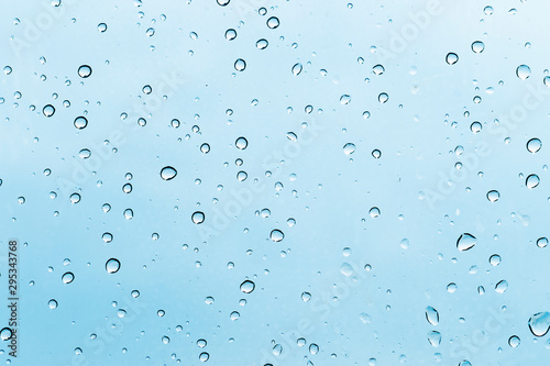 Water droplets on the bright glass for background and textured.