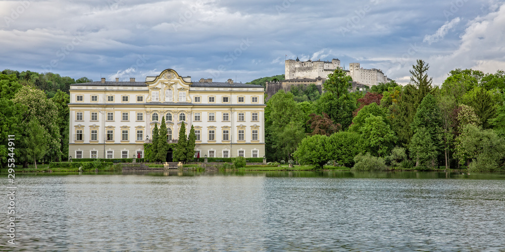 The Schloss Leopoldskron was one of the main film locations of The Sound of Music. View on Festung Hohensalzburg, Schloss Leopoldskron and the Leopoldskroner Weiher in Salzburg at the sunset, Austria