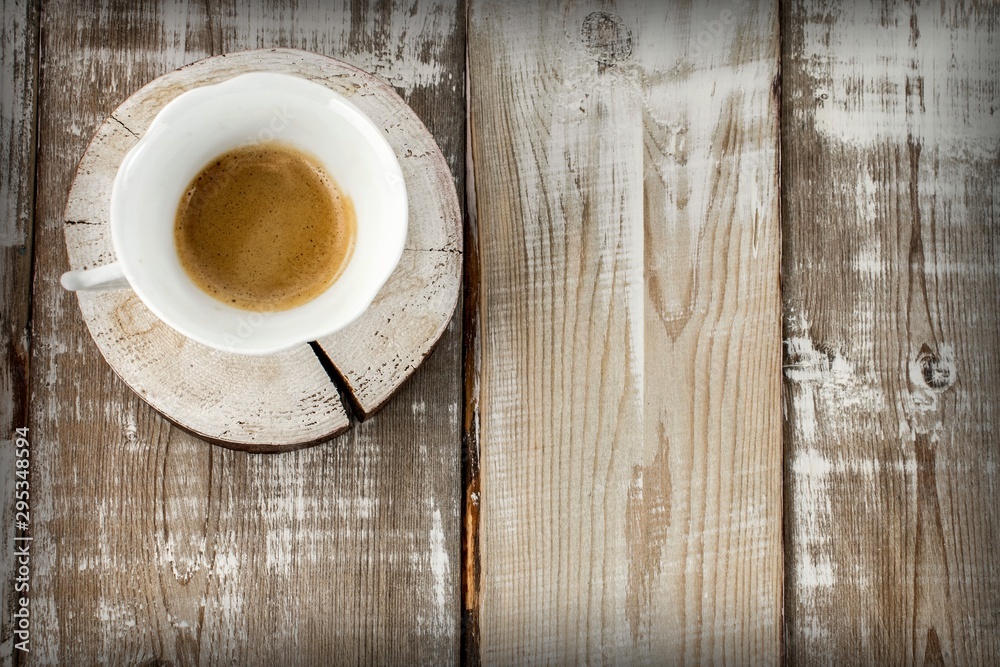 cup of coffee on wooden table cup of coffee on wooden table