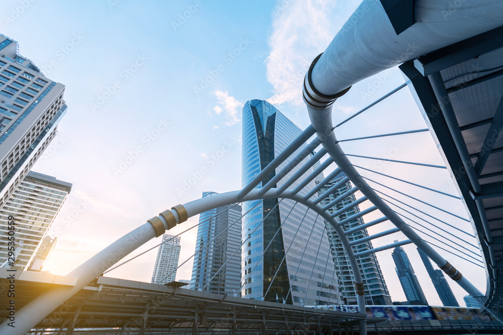 Obraz premium Office building in Sathorn-Silom business district in Bangkok, Thailand as in blue tone and sunset.
