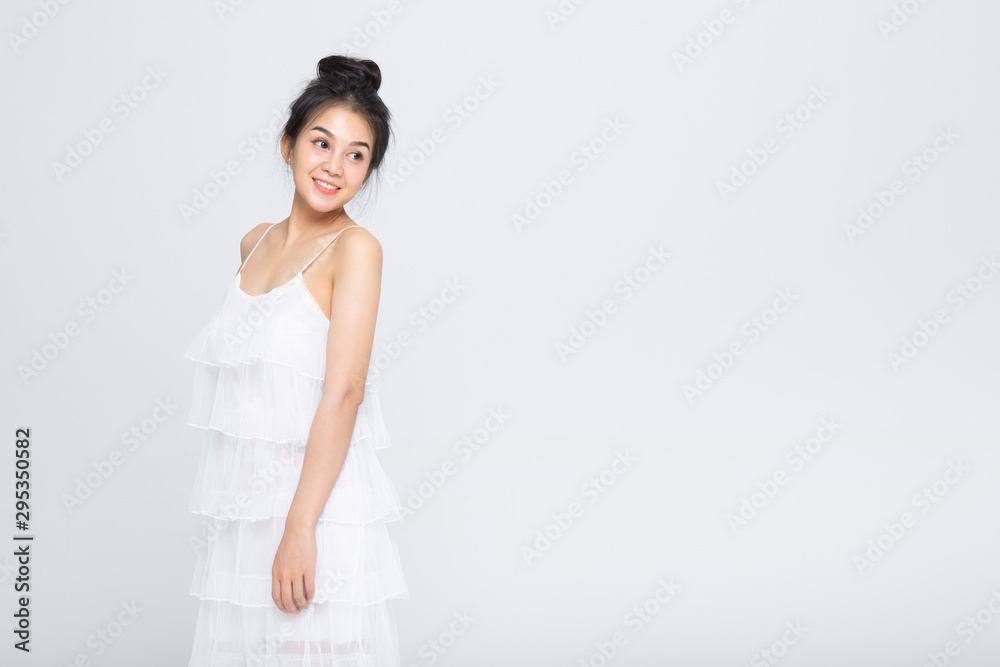 Beautiful young woman portrait. Studio shot, isolated on gray background Beautiful young woman portrait. Studio shot, isolated on gray background