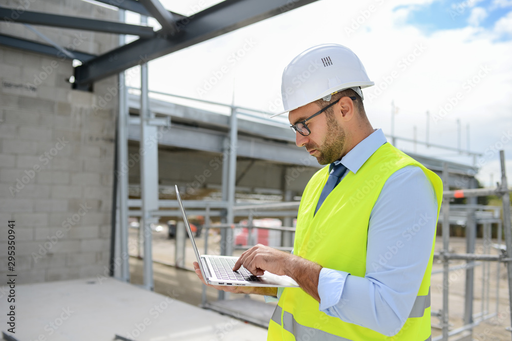 portrait of handsome foreman construction worker on a industrial building industry construction site portrait of handsome foreman construction worker on a industrial building industry construction site