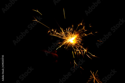 Colorful fireworks in night  bright sparkler candle for Christmas or new year Festival celebration isolated on black background  Blazing colored fire  Diwali Firework crackers sparkle lights on hand