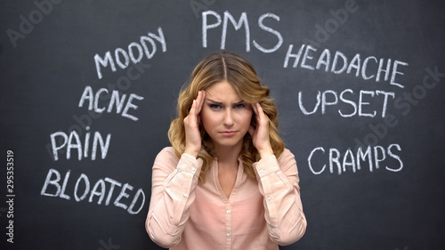 Woman suffering headache due to imaginary problems in pms, hormone imbalance photo