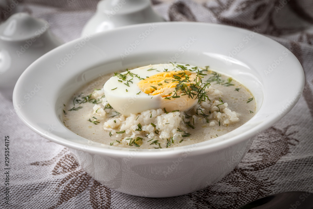 Sorrel soup with egg in white bowl. Sorrel soup with egg in white bowl.