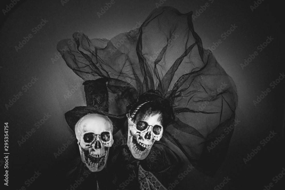 Black and white bride and groom skull wedding dresses symbol of the day of the dead and hallowed