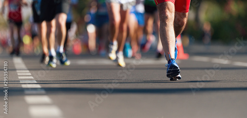 Marathon running race, people feet on city road © pavel1964