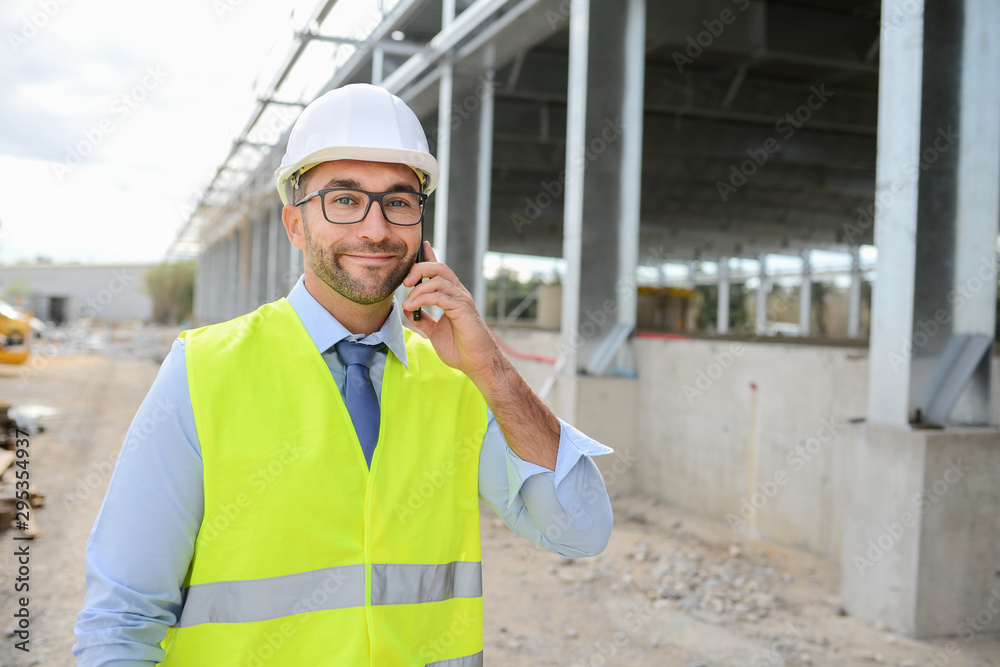 portrait of handsome foreman construction worker on a industrial building industry construction site portrait of handsome foreman construction worker on a industrial building industry construction site
